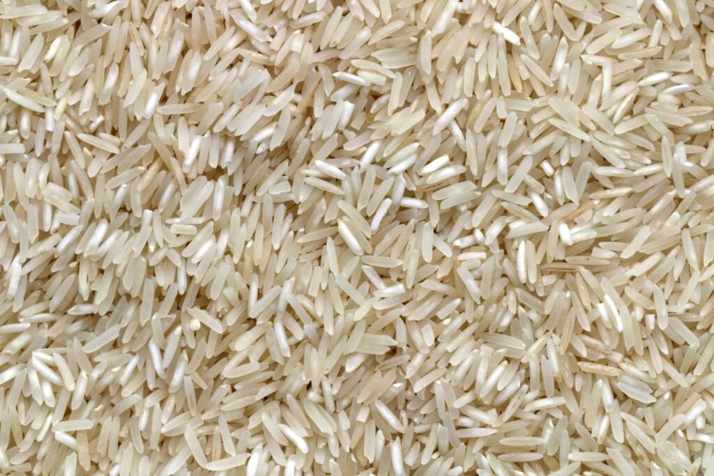 Uncooked white rice grains; illustrative stock photograph
